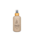 8oz beige and brown bottle of Focus Yoga Mat Grip Spray with peppermint and rosemary