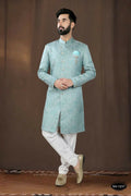 Toddler boy wearing a stylish blue woven jacquard kurta with matching pyjama trousers