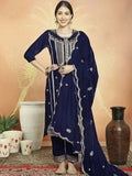 Woman wearing a Navy Blue velvet straight kurta with sequin and Resham thread embroidery and matching trousers.