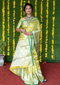 Elegant green soft handloom silk saree with gold zari woven details and matching blouse