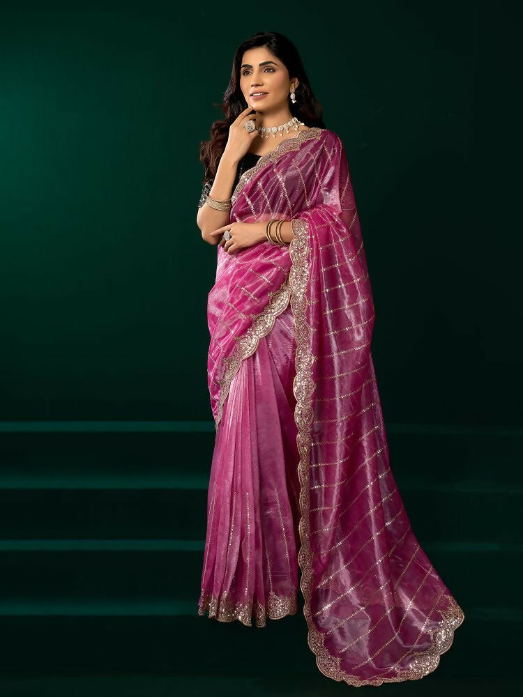 Elegant pink net party wear saree paired with a black velvet blouse