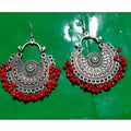 Fancy Chandbali earrings featuring vibrant red pearls and intricate metalwork