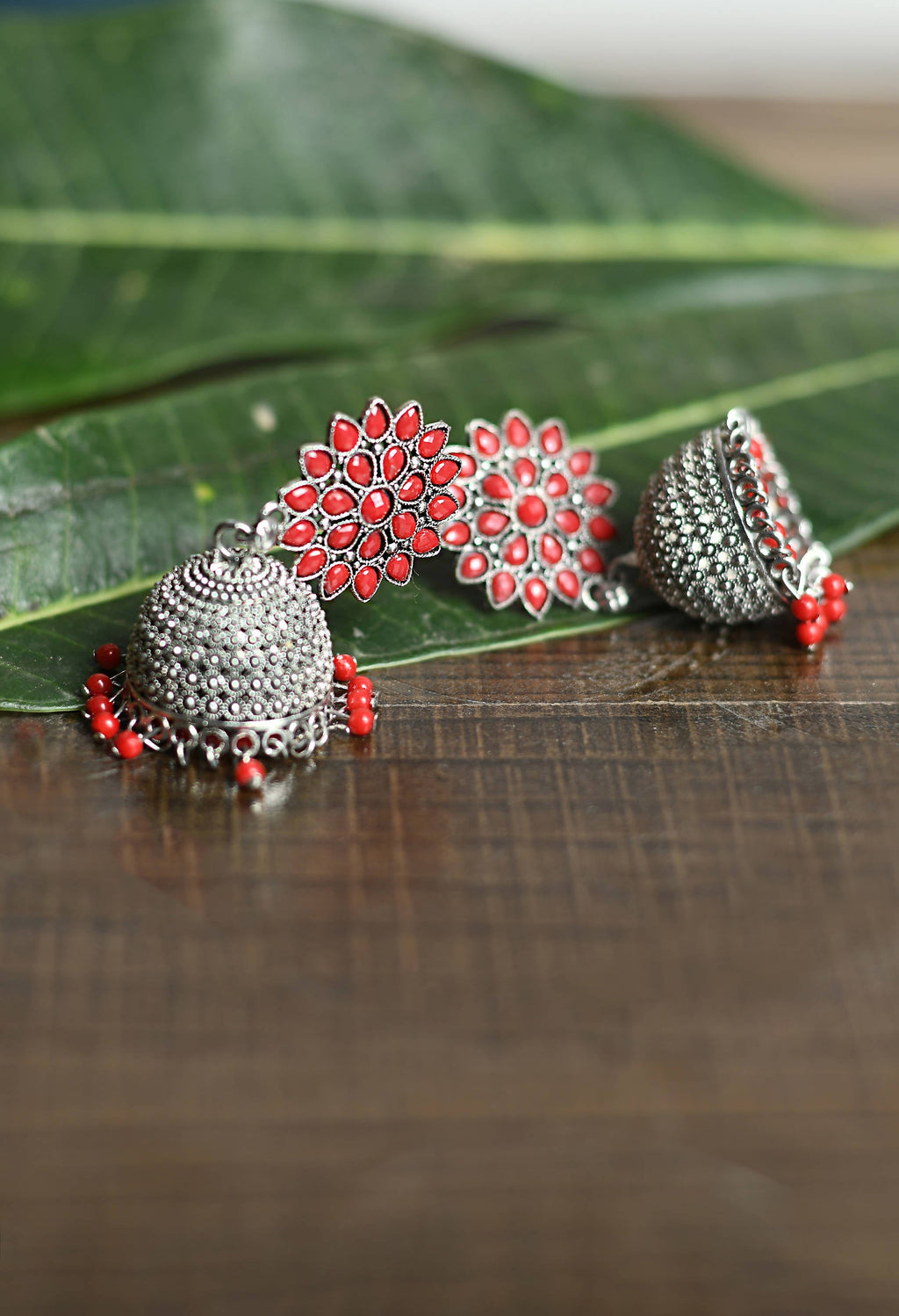 Kundan Work Jhumka Earrings with Red Beads for Festive Wear