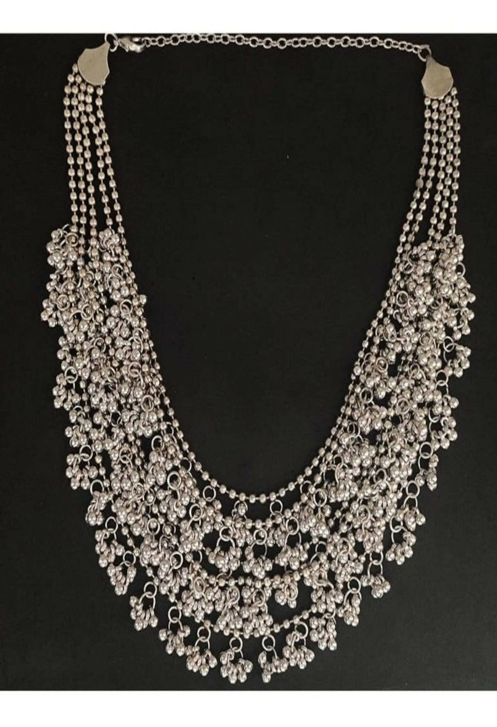 Mominos Fashion silver-plated brass oxidised ghungroo long necklace set with matching earrings