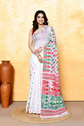 A woman wearing a white embellished cotton blend Jamdani saree with traditional woven patterns.