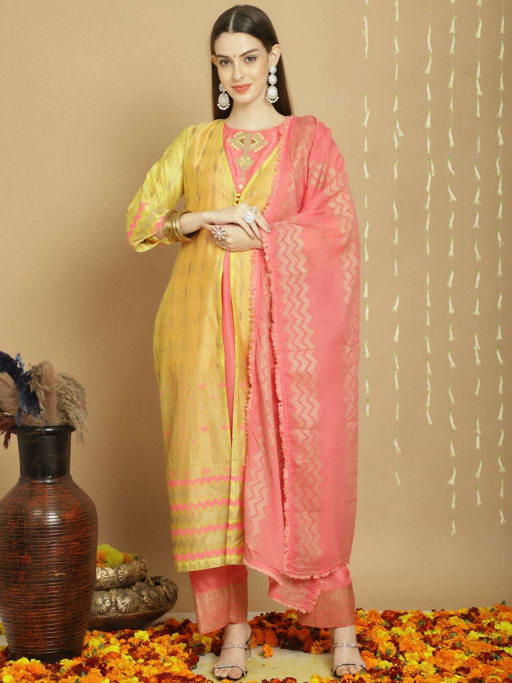 Women's yellow Chanderi silk A-line kurta set with intricate Jardoshi work, art silk pants, and cotton dupatta.
