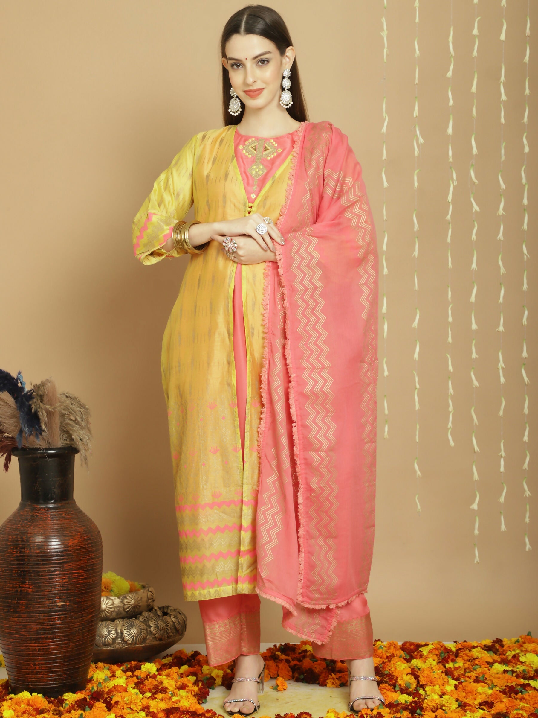 Women's yellow Chanderi silk A-line kurta set with intricate Jardoshi work, art silk pants, and cotton dupatta.