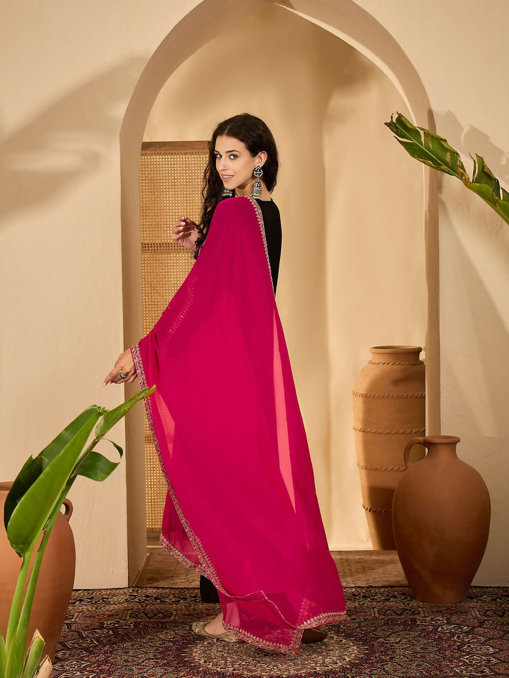 Regal black Vichitra silk kurta set with exquisite embroidery, perfect for festive wear.