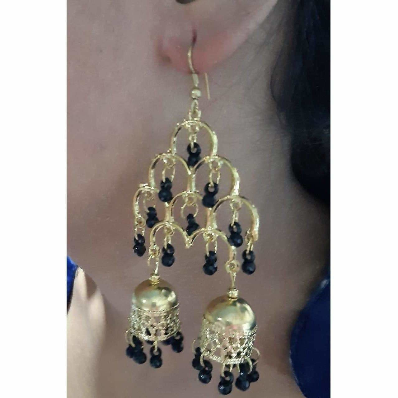Gold-polished traditional double jhumka earrings with hanging black pearls