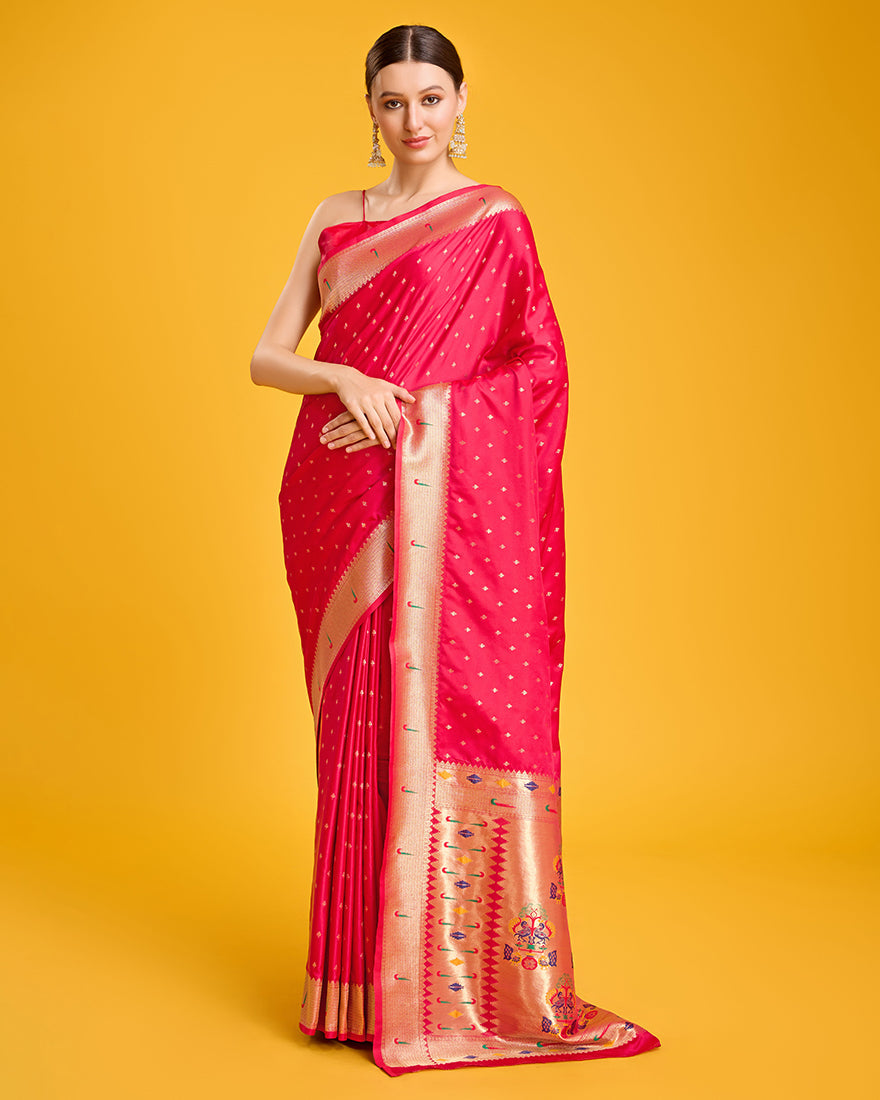 Bright pink Paithani silk saree with detailed gold zari work
