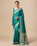 Regal turquoise Paithani silk saree with intricate gold zari woven details