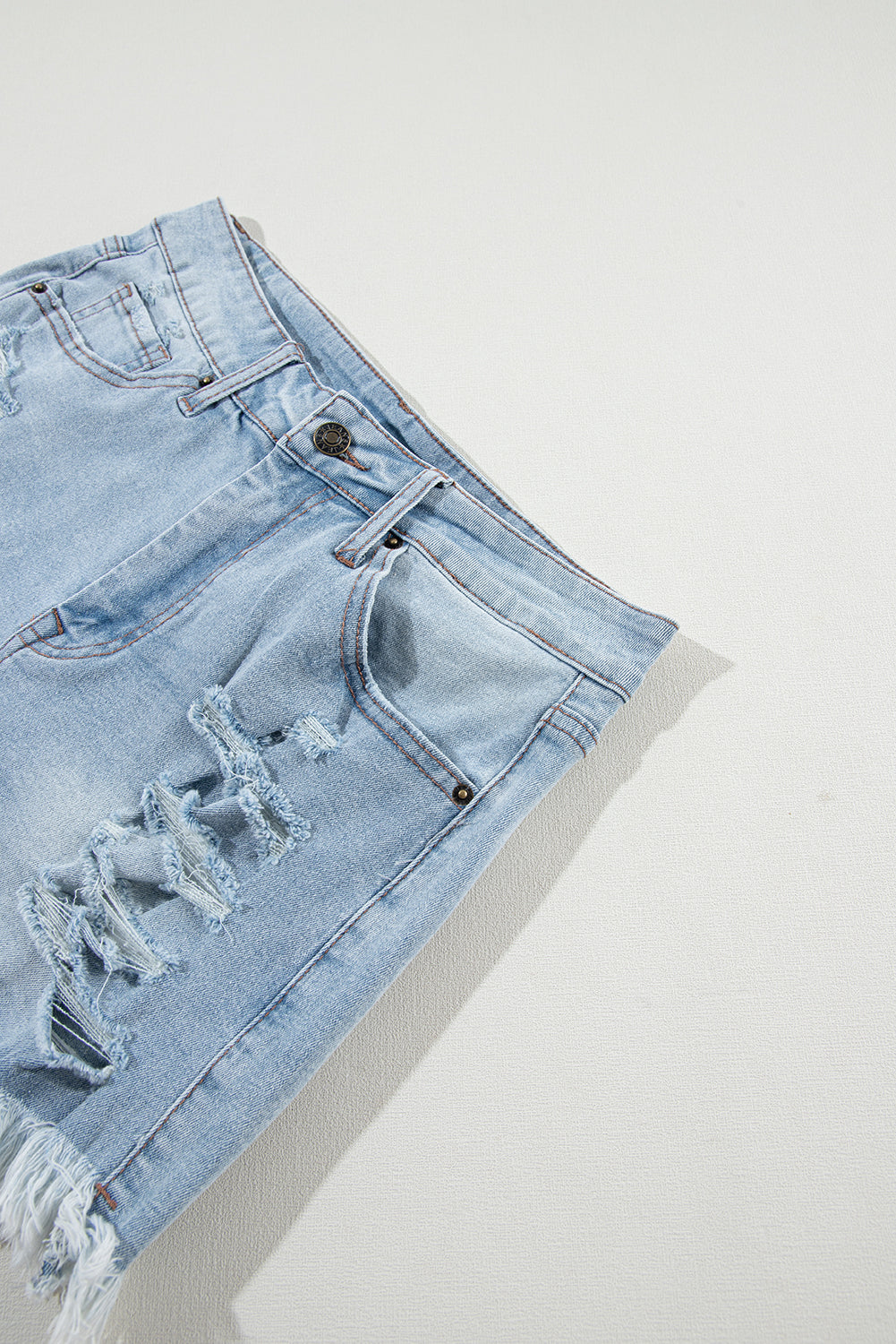Distressed Denim Raw Hem High Waist Shorts in Light Blue