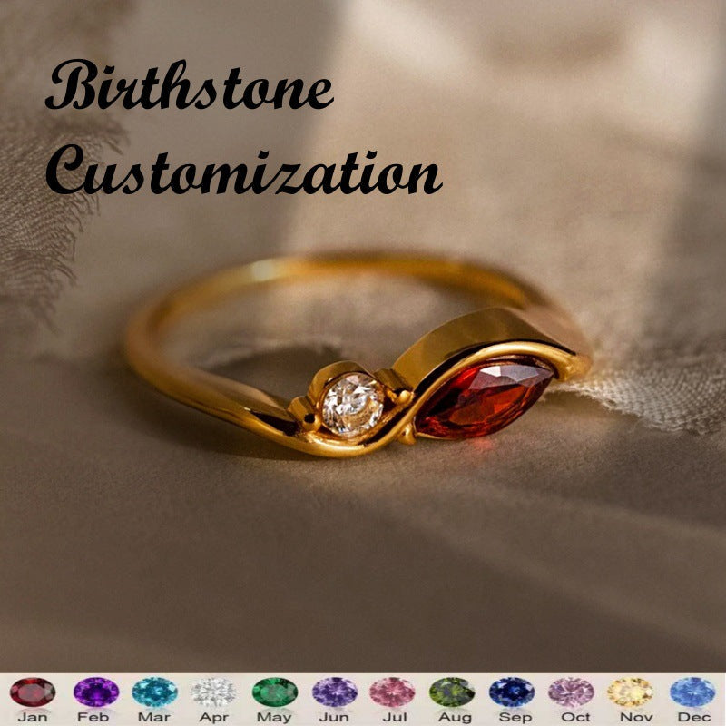 Elegant wave-design ring featuring two custom birthstones and a polished copper finish