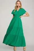 Green tiered maxi dress with surplice neckline and short sleeves.