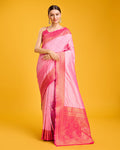 Elegant light pink Banarasi silk saree with intricate gold zari brocade patterns