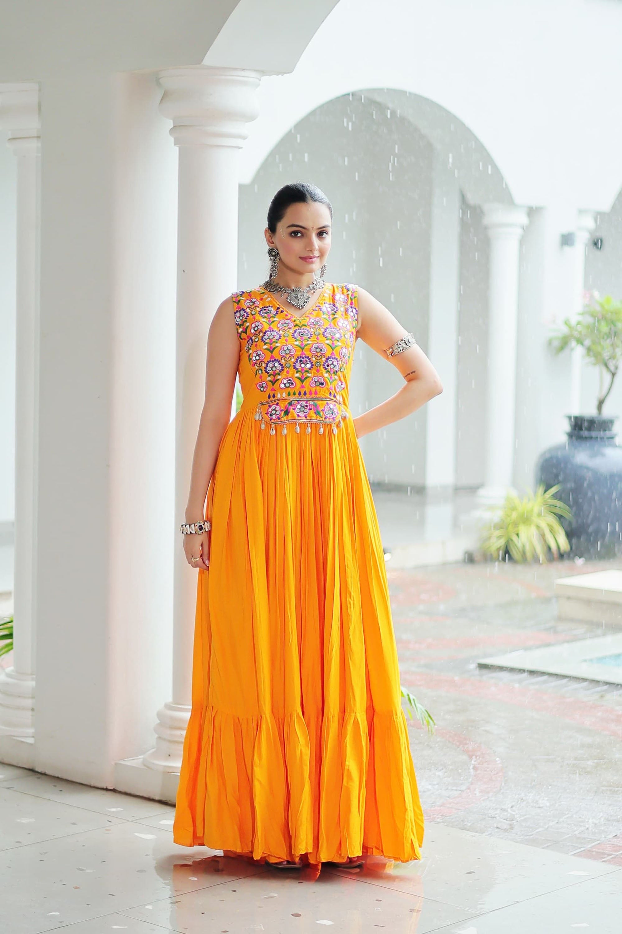Yellow Rayon gown with intricate Kutchi Gamthi embroidery and mirror work for Navratri