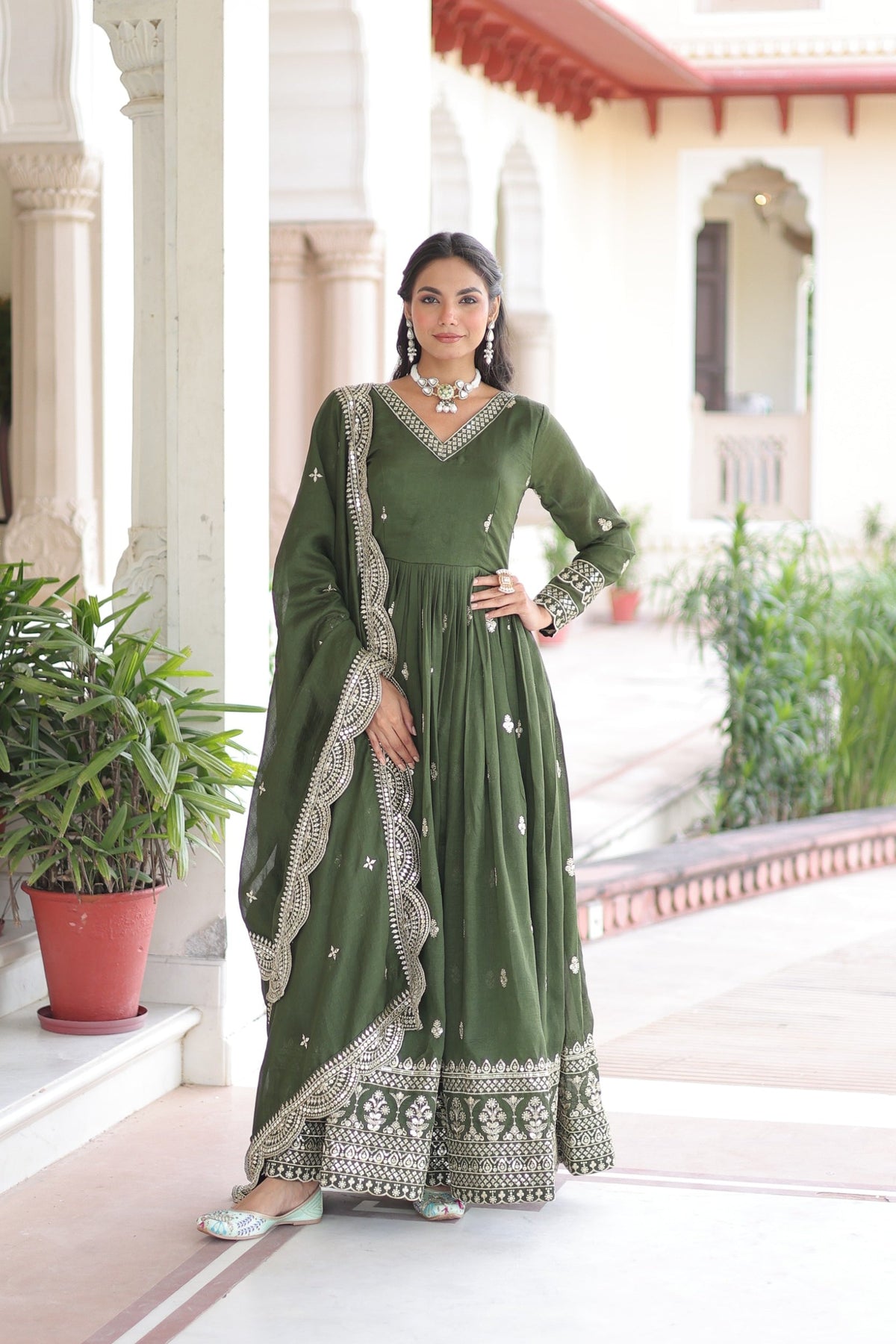 Mehendi colored Vichitra Silk Anarkali gown with intricate Zari and sequin embroidery and matching dupatta.