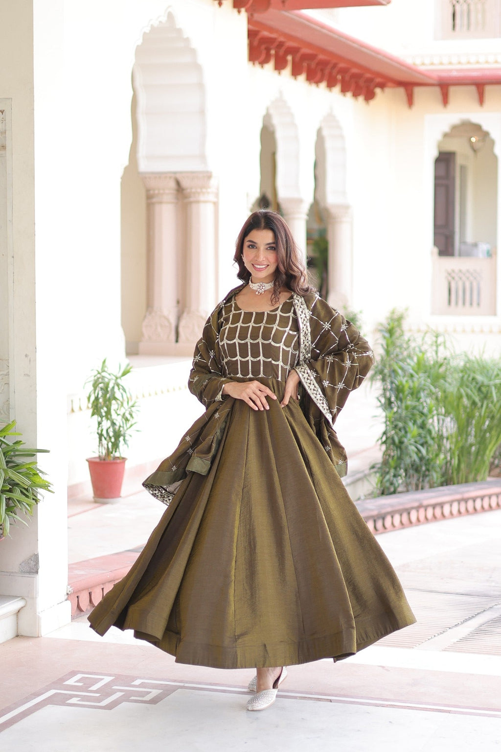 Mehendi Vichitra Silk Anarkali gown with rich sequins and zari embroidery, including a matching dupatta.