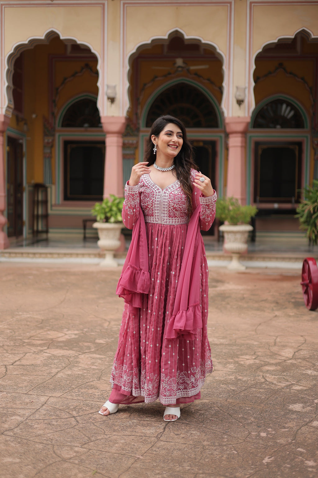 Peach Faux Georgette kurta palazzo set with sequins and thread embroidery detailing