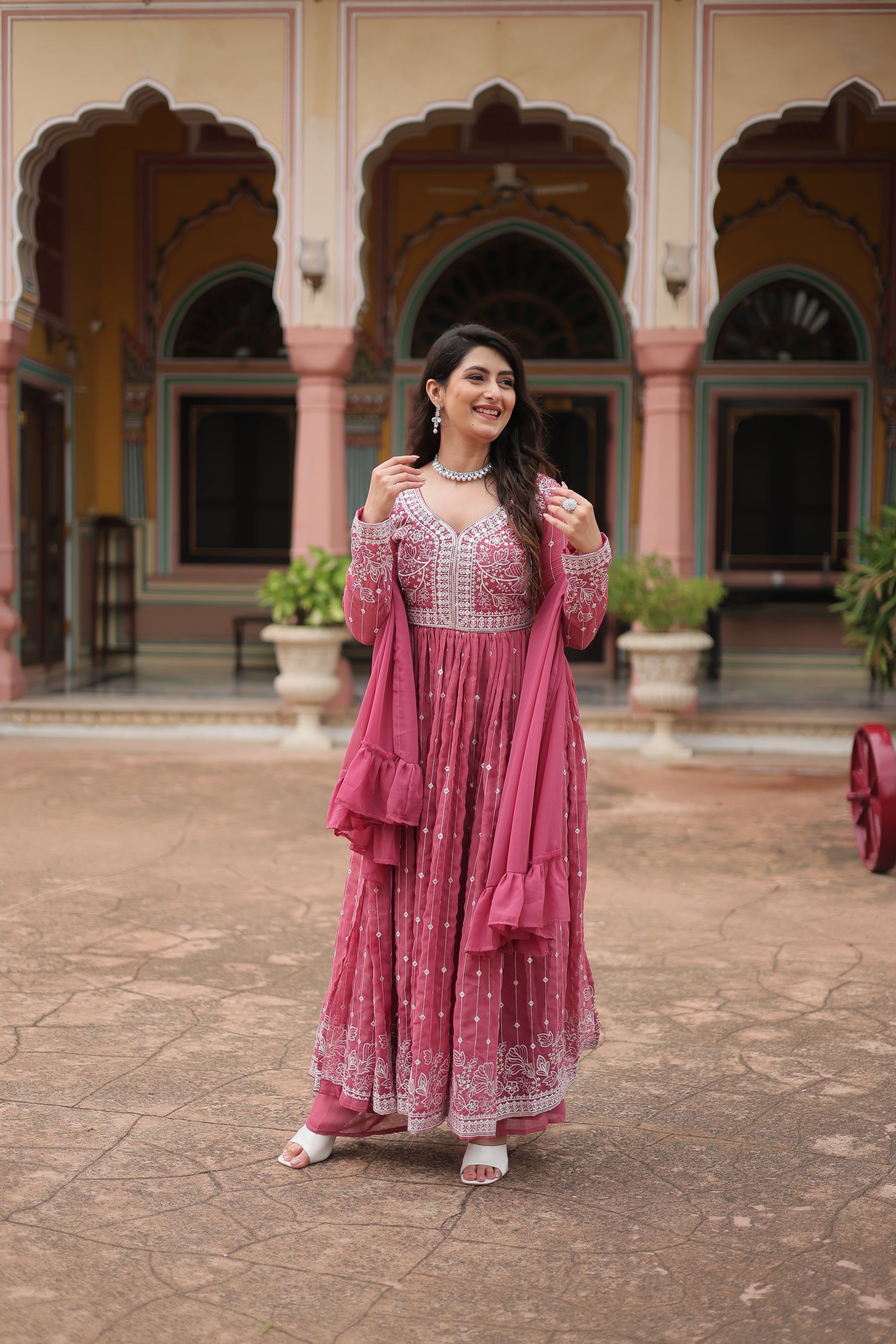 Peach Faux Georgette kurta palazzo set with sequins and thread embroidery detailing