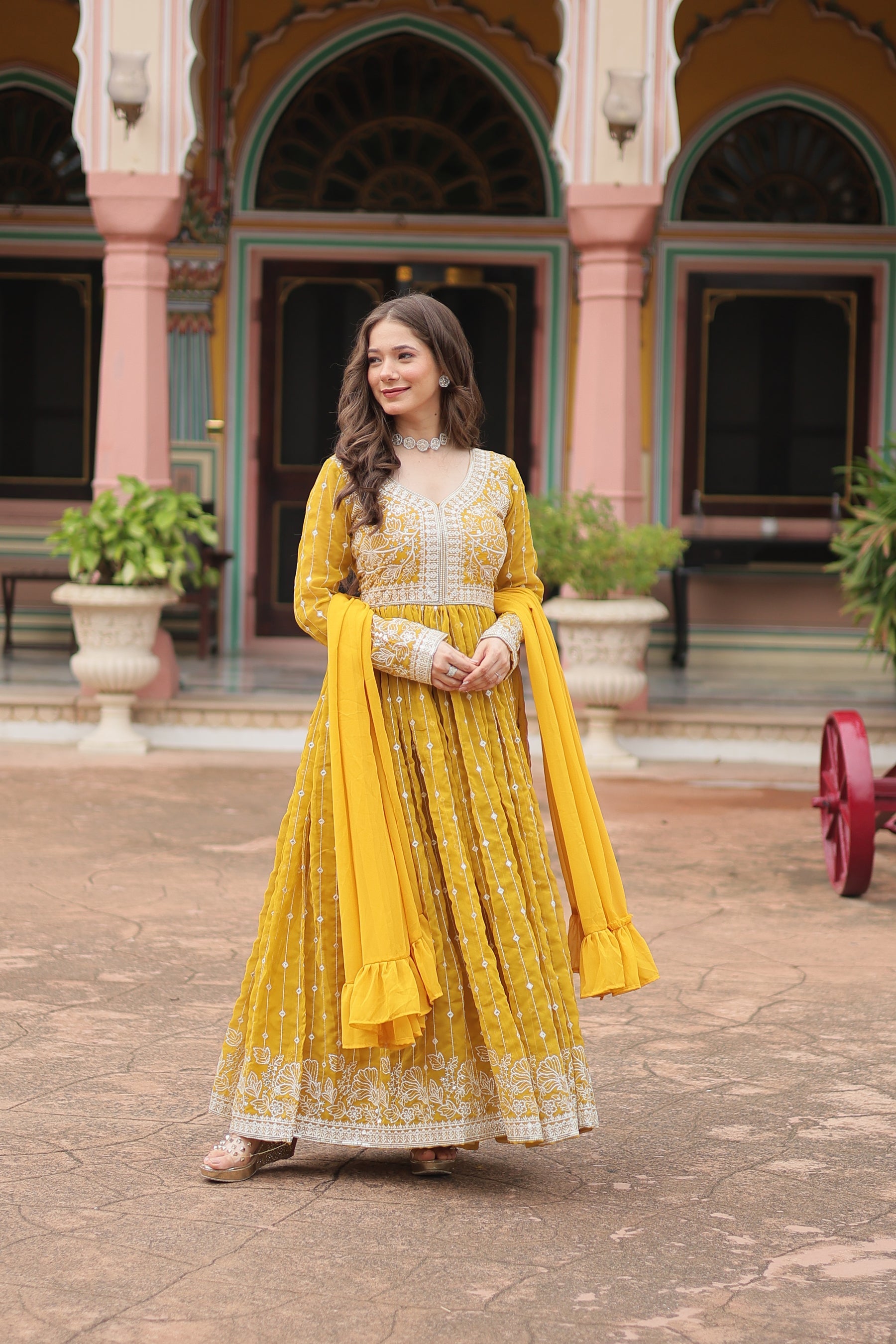 Yellow Faux Georgette kurta palazzo set with sequins and thread embroidery