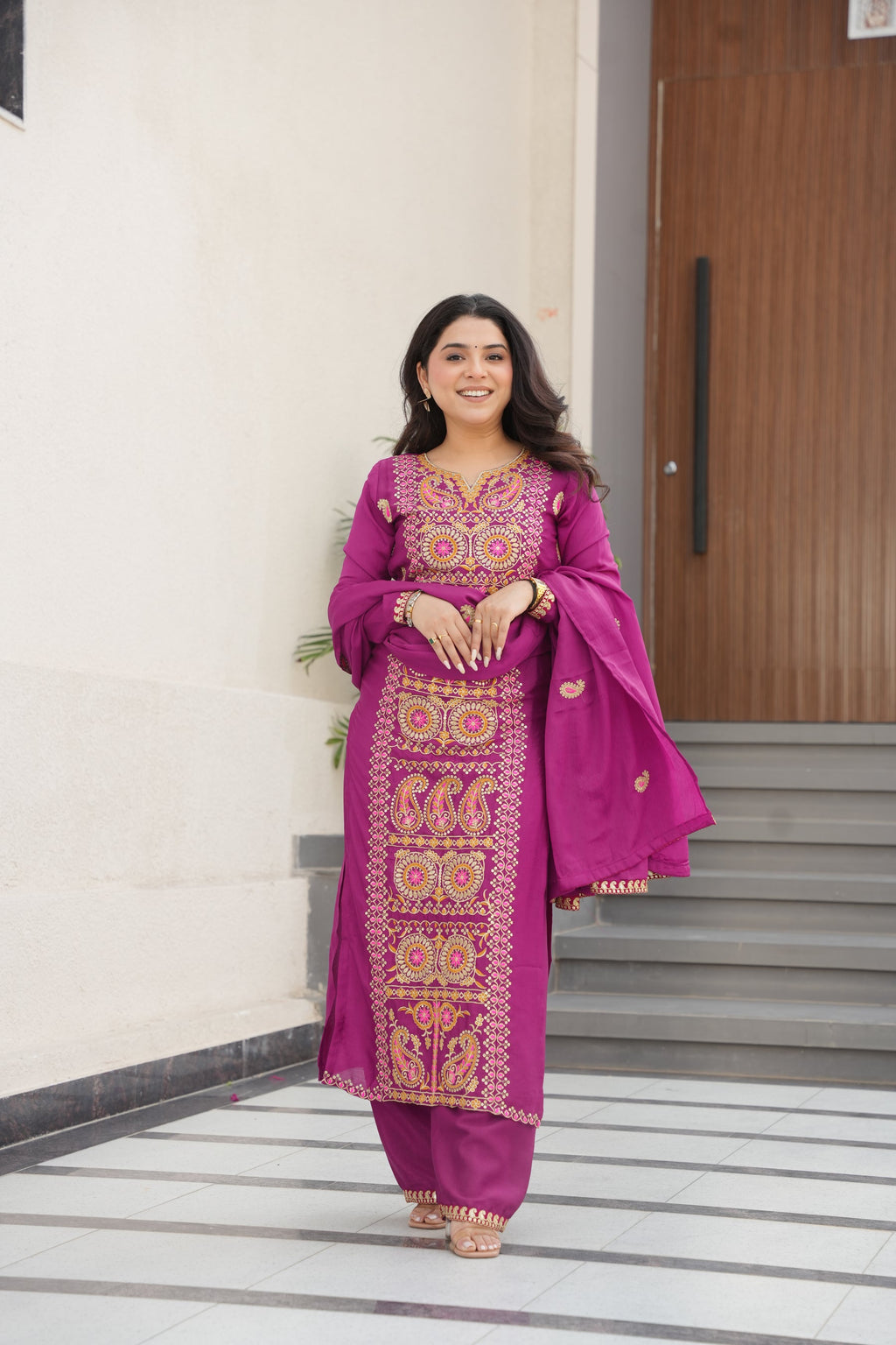 Magenta Chinon Silk kurta paired with pants and an embroidered dupatta, featuring Zari and thread work.