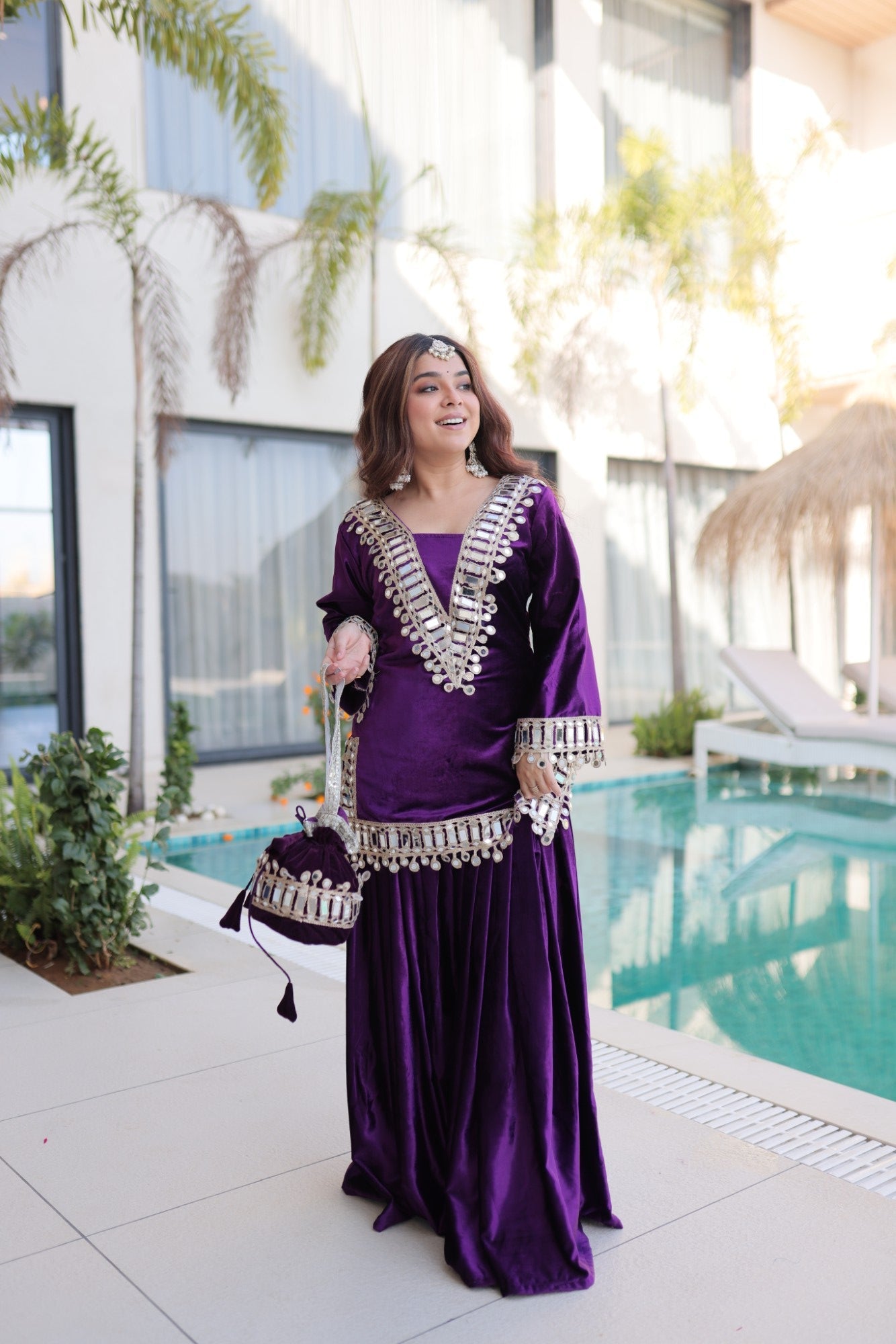 Purple velvet kurta palazzo set with intricate gold Zari embroidery and authentic mirror work detail