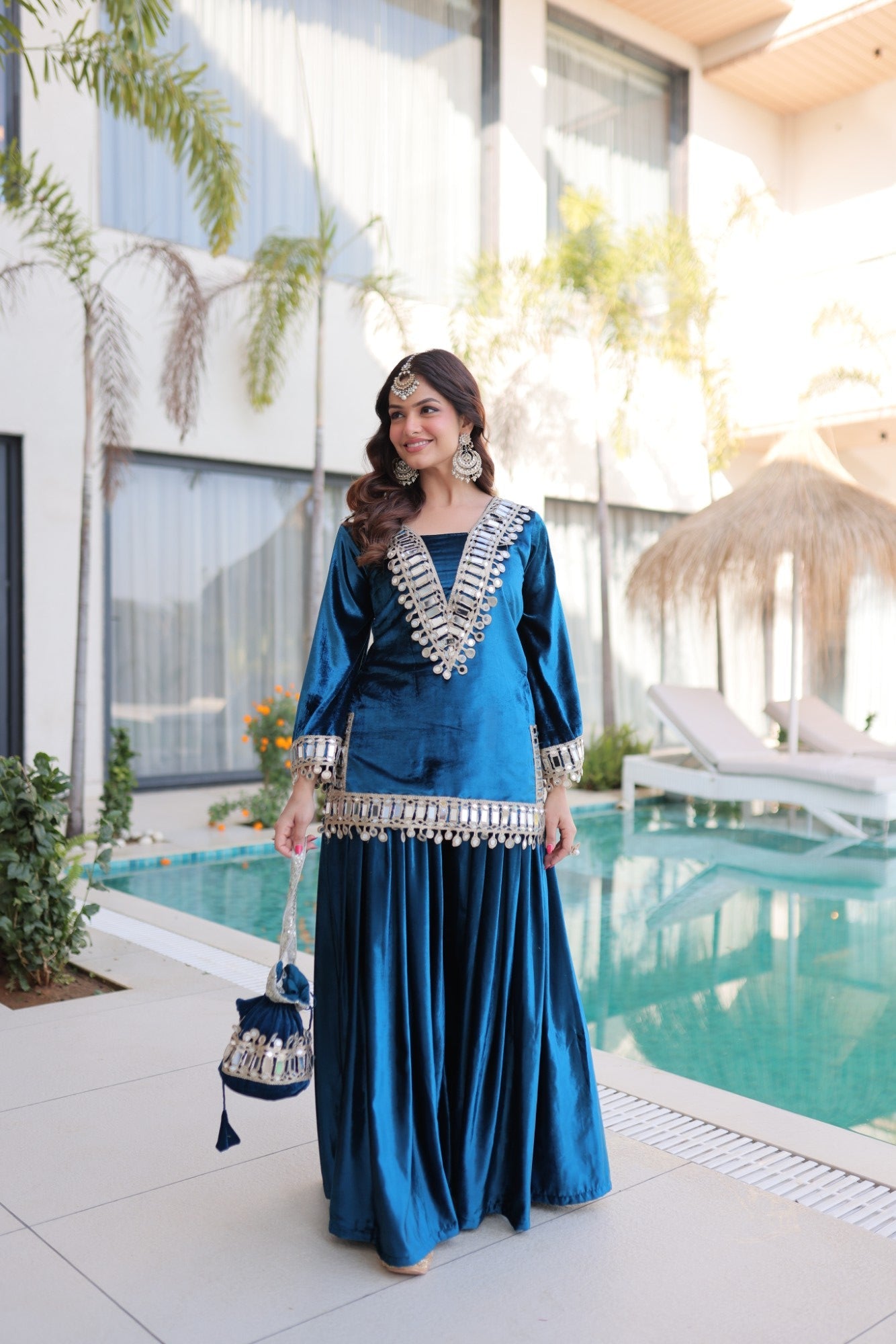 Rama velvet kurta set with zari embroidery and mirror work detailing, including palazzo and dupatta.