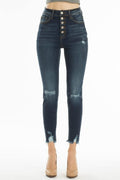 High rise dark blue denim jeans with distressed knees and five-button closure front view