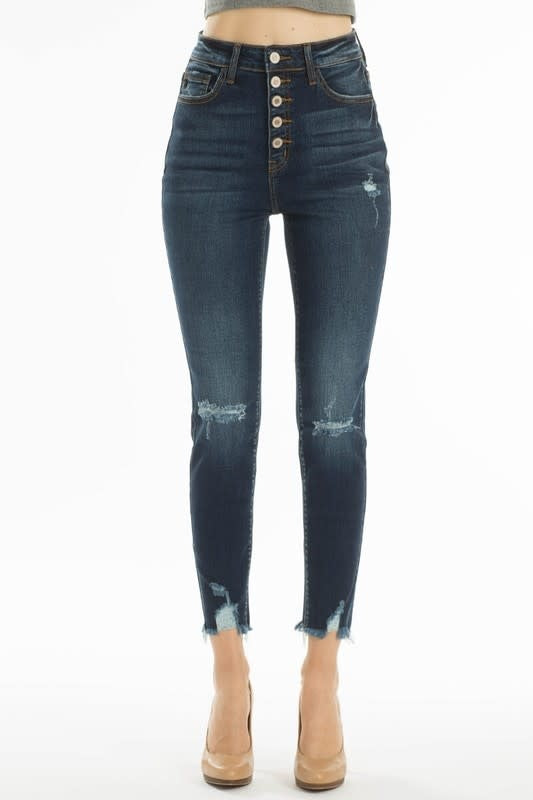 High rise dark blue denim jeans with distressed knees and five-button closure front view