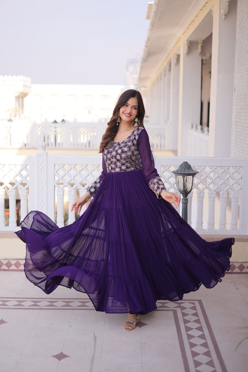 Front view of a purple faux blooming gown with sequins, zari, and pipe embroidery detailing.