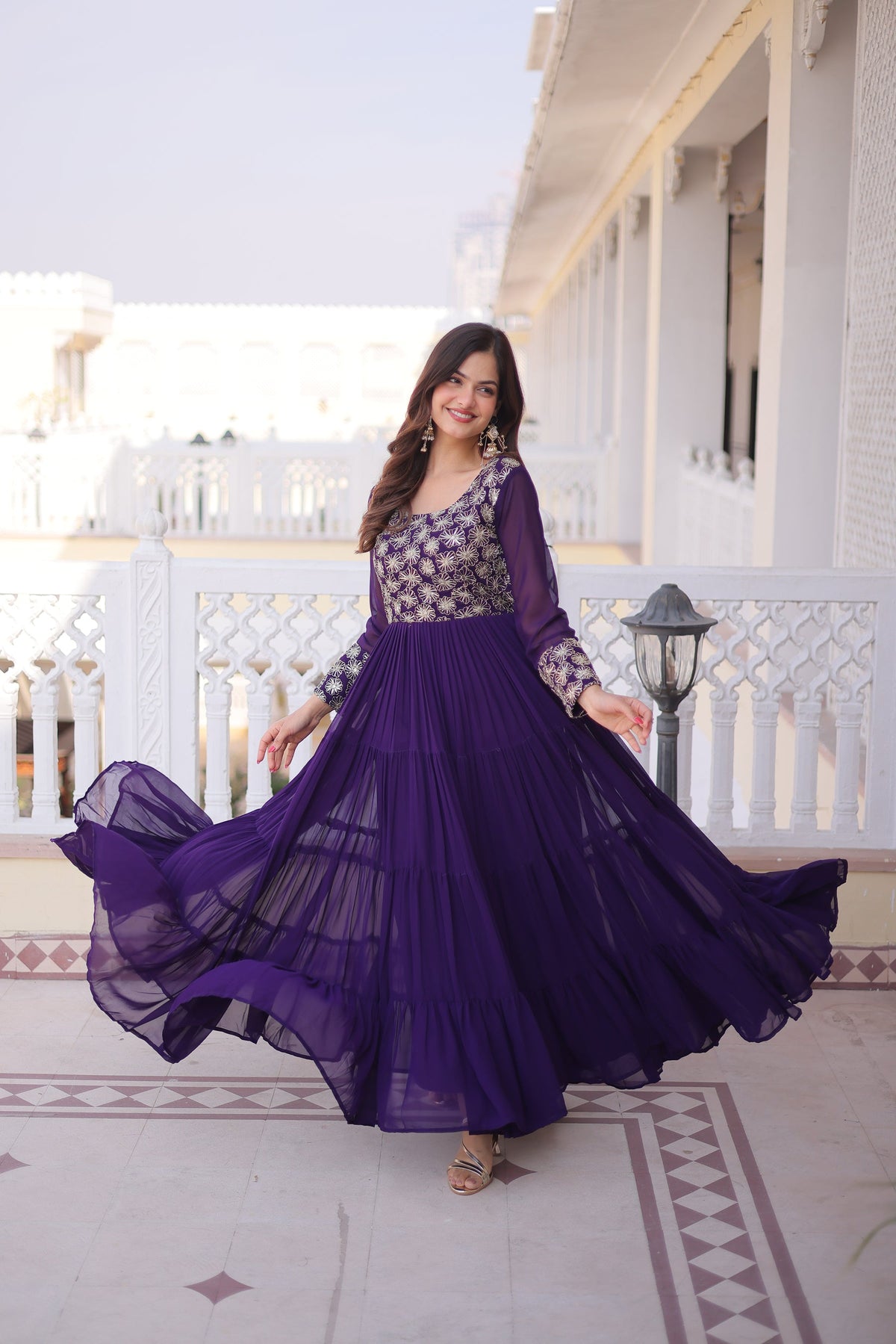 Front view of a purple faux blooming gown with sequins, zari, and pipe embroidery detailing.