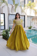 Mehendi green silk floor-length party gown with intricate gold sequins, zari, and pipe bead embroidery.