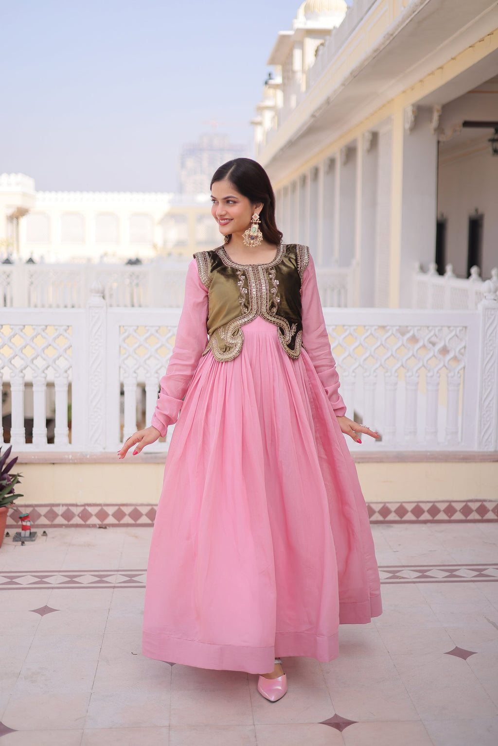 A pink Mal Chanderi flair gown paired with an embroidered Ice Velvet Koti, displaying its 3-meter flare and intricate beadwork.