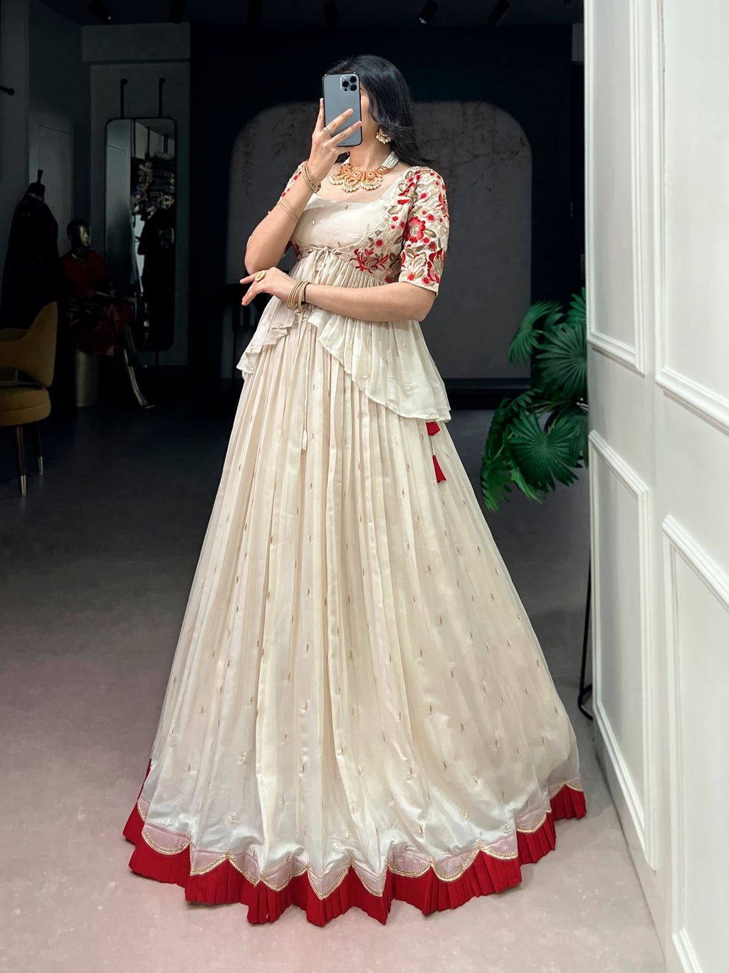 Offwhite Chocolate Silk lehenga choli with detailed sequins, thread embroidery, and a matching coat