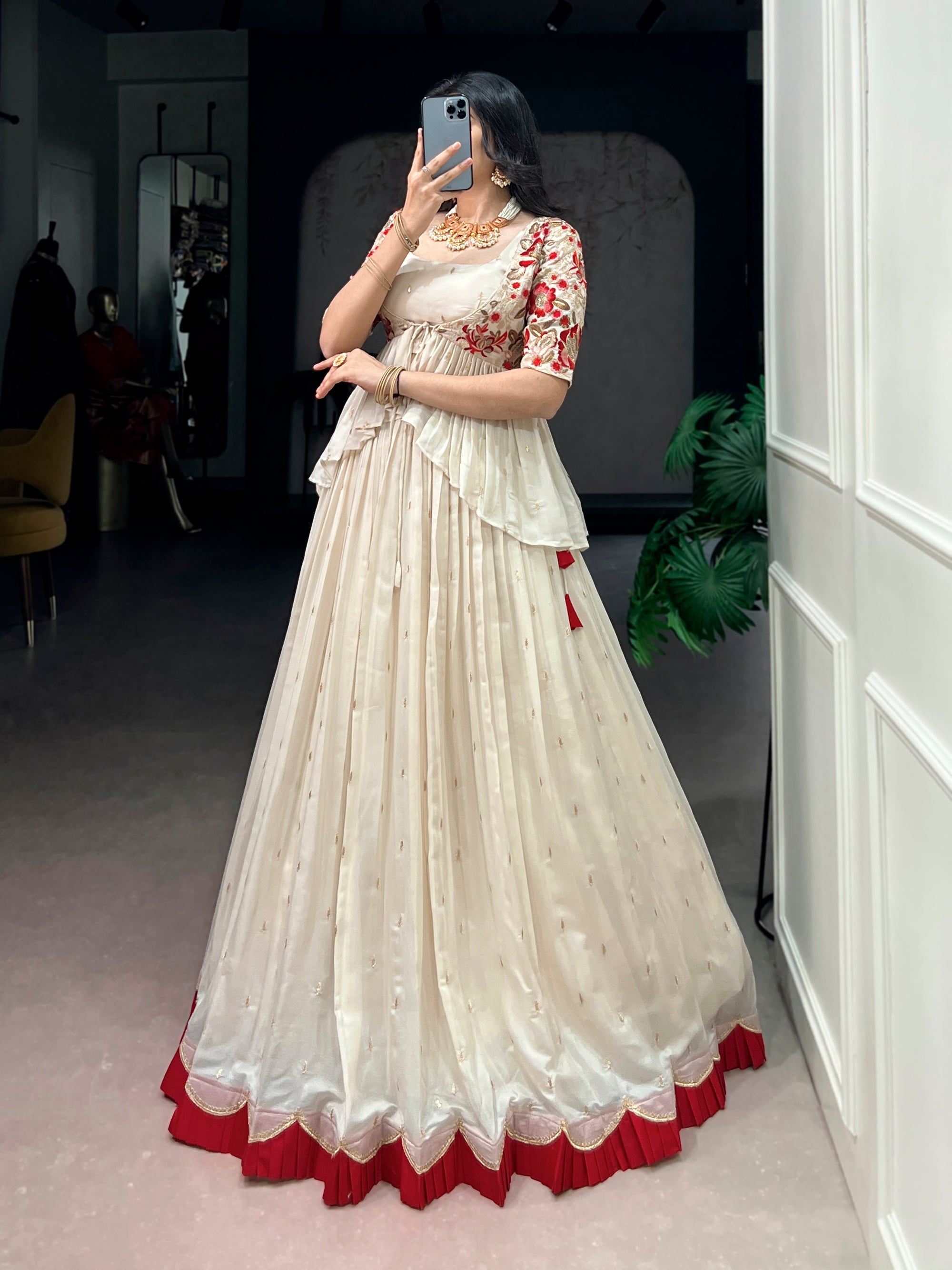 Offwhite Chocolate Silk lehenga choli with detailed sequins, thread embroidery, and a matching coat