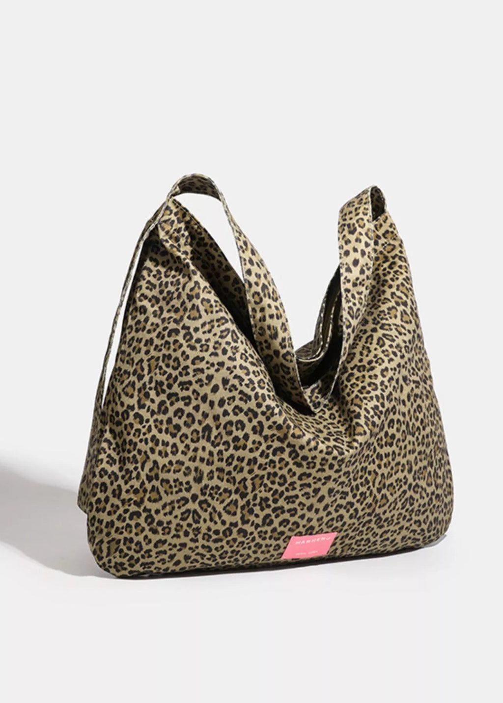 Leopard print bag with a pink tag on a white background