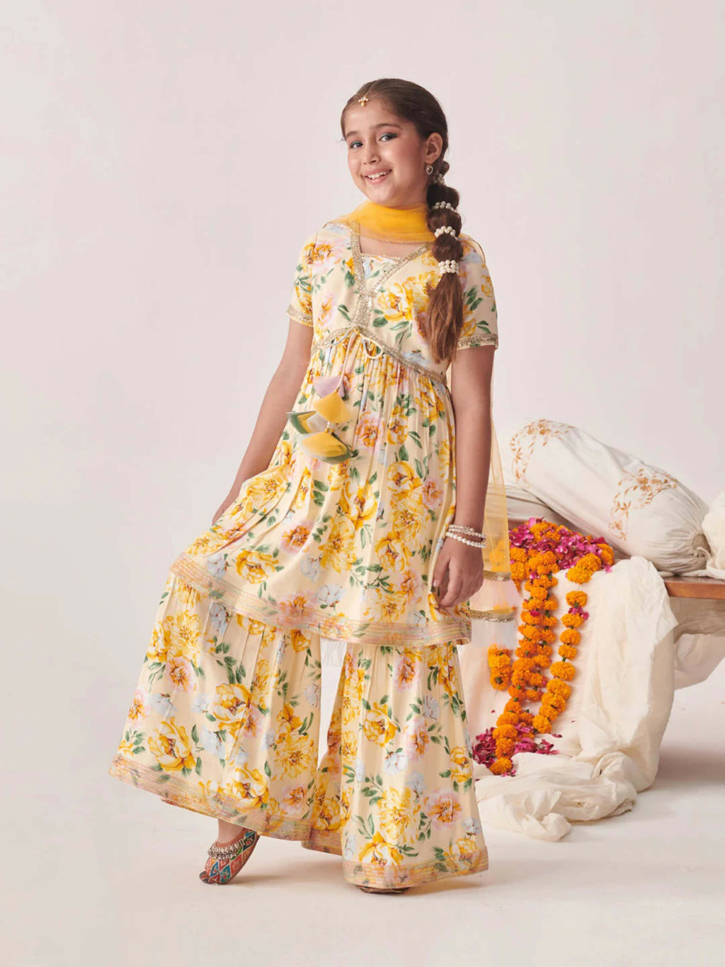 Bright white and yellow cotton blend sharara set with a net dupatta for young girls.