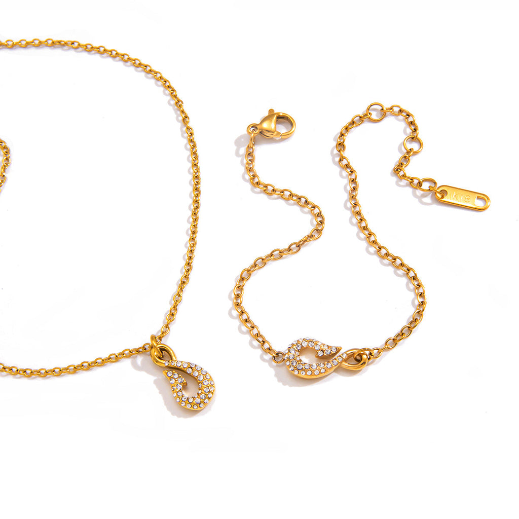 Minimalist gold fish hook necklace and matching bracelet set with zircon accents.