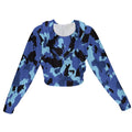 Front view of a women's blue camouflage print cropped zip-up jacket with a hood, on a white background.