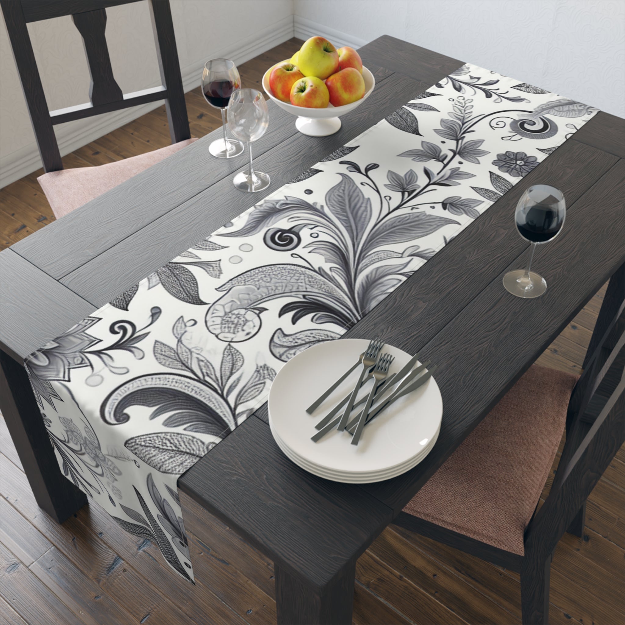 Elegant floral table runner draped over a dining table, styled for a wedding or holiday celebration.