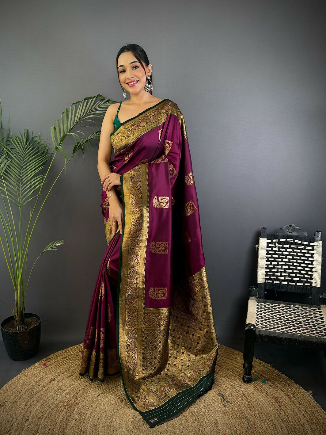 Elegant black Banarasi silk saree with peacock designs and unstitched blouse fabric.