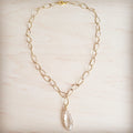 Gold-tone chain necklace with textured oval links and a single faceted clear teardrop pendant.