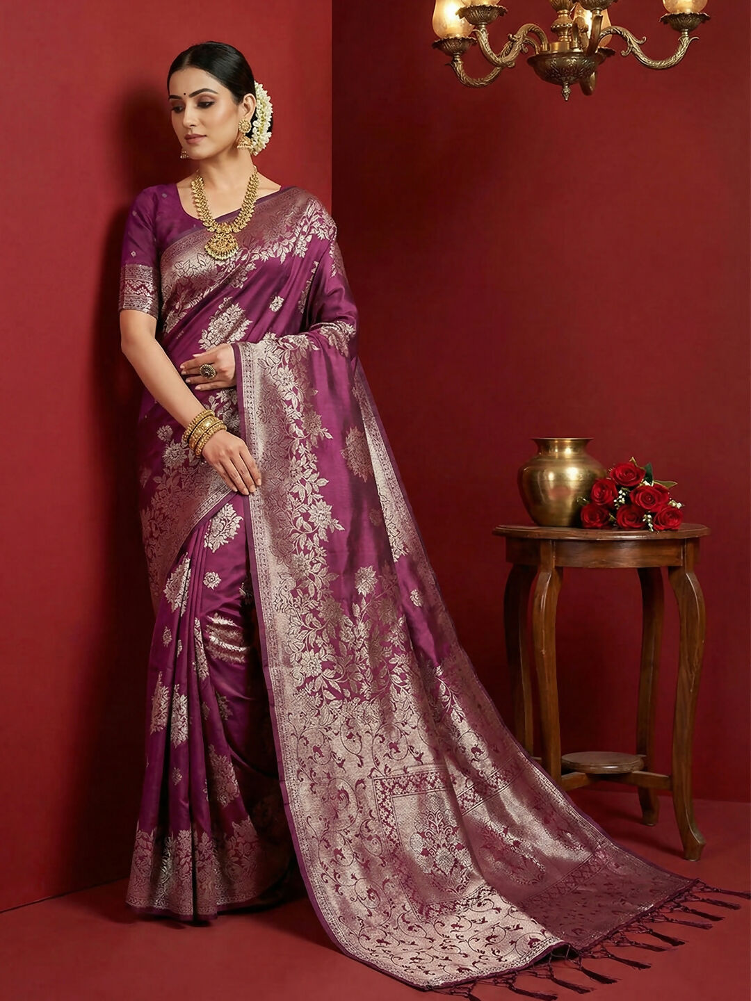 A beautiful purple silk blend saree with a matching blouse piece, displayed elegantly.
