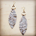 Genuine leather oval earrings with gold-tone hammered metal rings and Gilded Cowboy patterned leather drops.