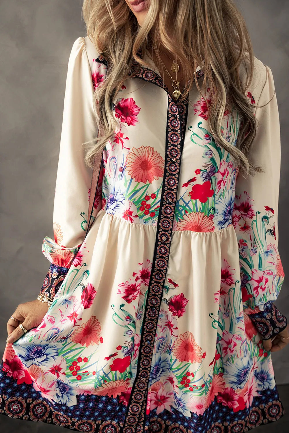 Woman wearing a vintage-style floral button-down dress with lantern sleeves