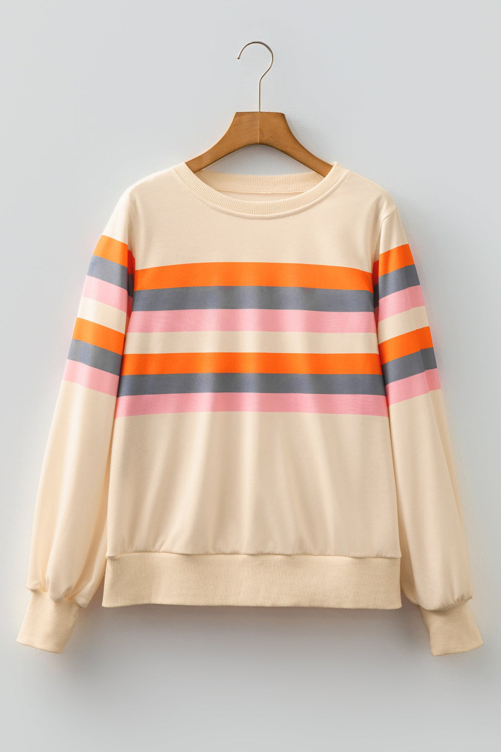 Women's cream pullover with orange, pink, and grey horizontal stripes and puff sleeves on a wooden hanger