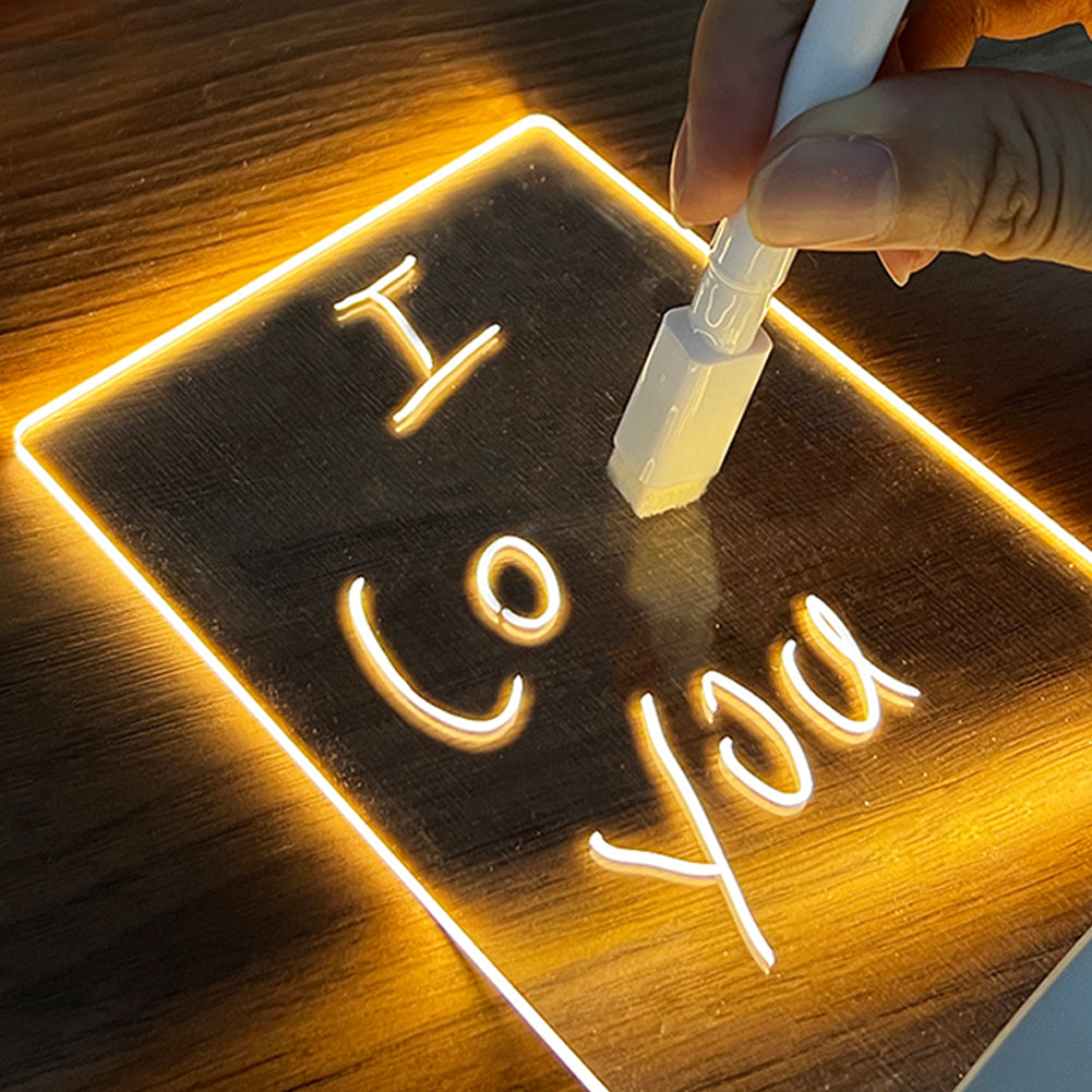 Modern acrylic LED message board night light with a natural wood base on a desk