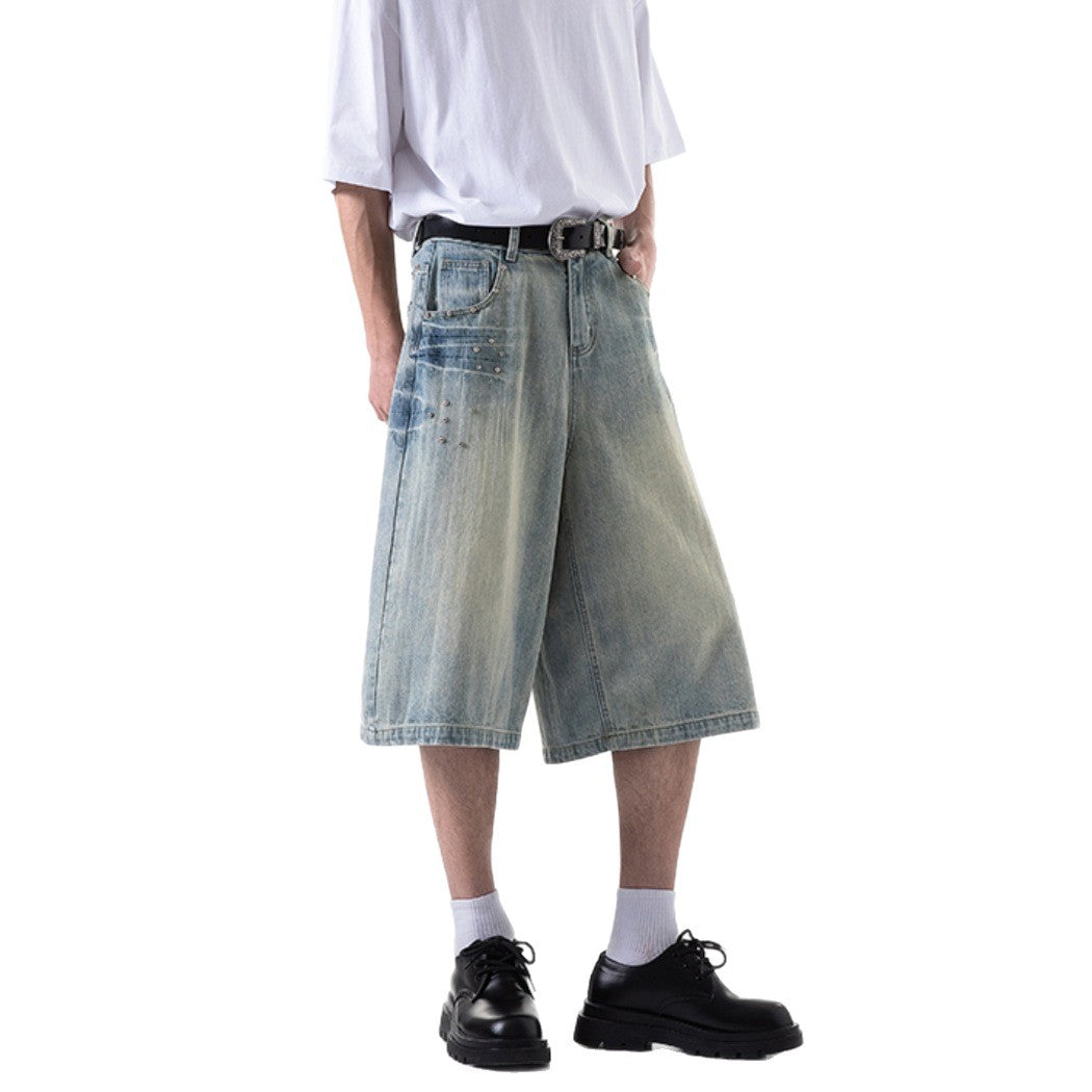 A person modeling light blue and dark blue faded wide-leg cropped Harajuku style denim jeans, paired with casual tops and black shoes.
