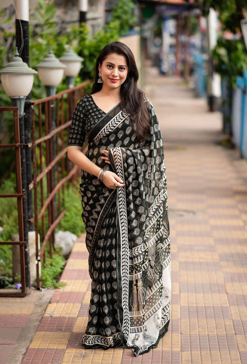 Black Poly Georgette Ajrak print saree with aari mirror work detail